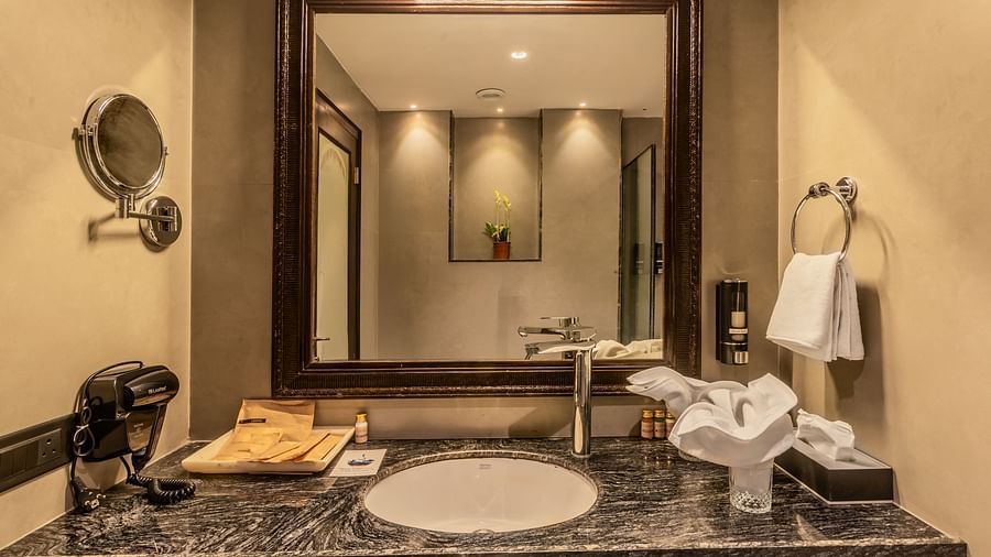 an image of a washroom with a a towel and a hanger